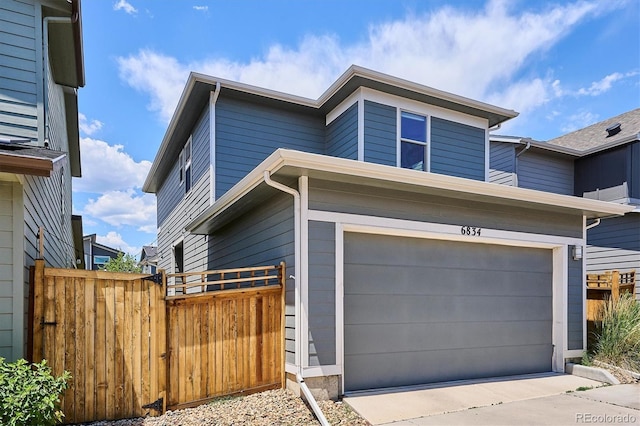 6834 Clay St N, Denver, CO 80221 - view of property exterior with an attached garage