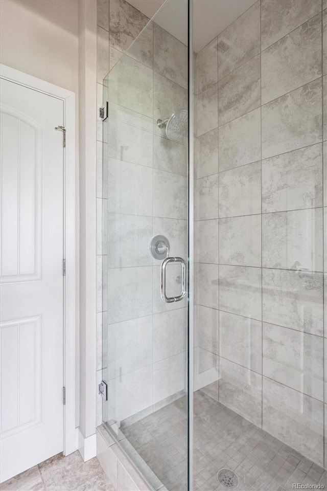 6834 Clay St N, Denver, CO 80221 - bathroom with a stall shower and tile patterned floors