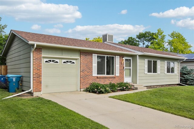4759 S Xenophon St, Morrison, CO 80465 - ranch-style home with a garage, concrete driveway, a front yard, and brick siding