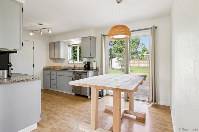 4759 S Xenophon St, Morrison, CO 80465 - kitchen featuring gray cabinetry, dishwasher, light wood-style flooring, and hanging light fixtures