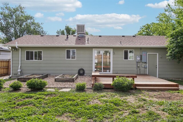 4759 S Xenophon St, Morrison, CO 80465 - rear view of property with a deck, a garden, and a chimney
