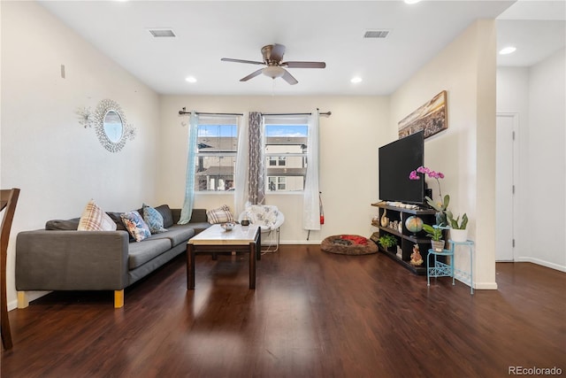 living room with ceiling fan and dark hardwood / wood-style flooring