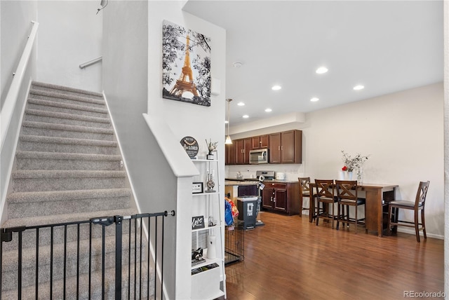 staircase with wood-type flooring