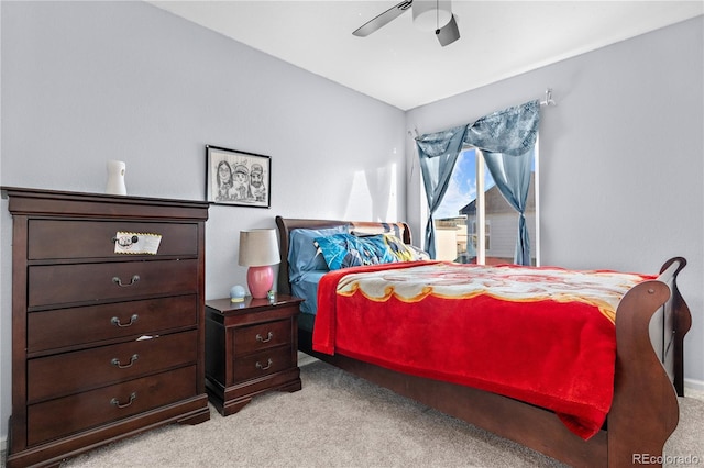 bedroom with light colored carpet, ceiling fan, and lofted ceiling