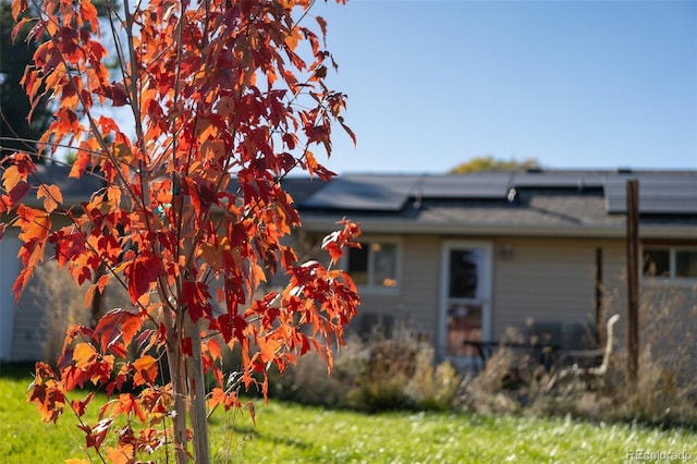 view of home's exterior featuring solar panels