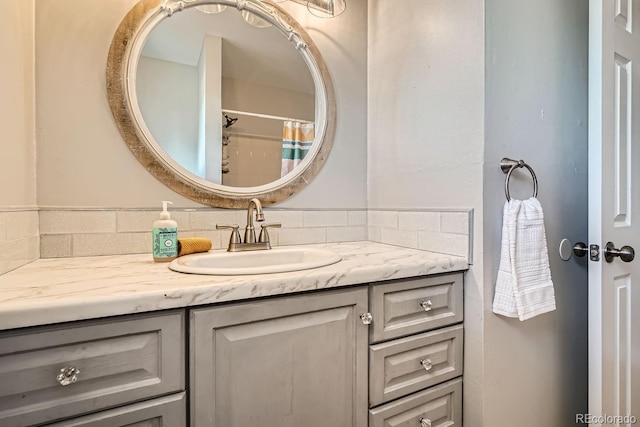 full bathroom with vanity and a shower with shower curtain