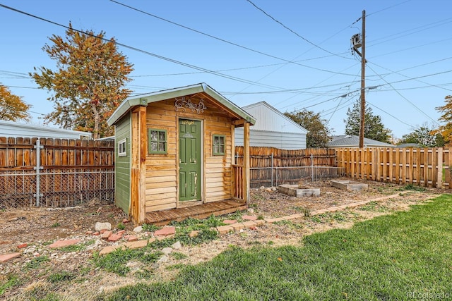 view of shed featuring a fenced backyard