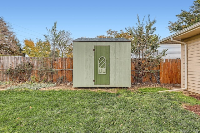 view of shed featuring a fenced backyard