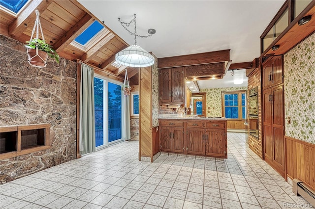 kitchen with wood ceiling, kitchen peninsula, hanging light fixtures, light tile patterned flooring, and a baseboard heating unit