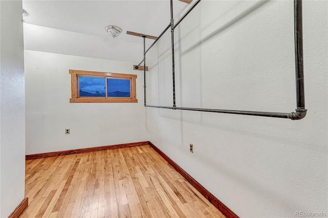 empty room with light hardwood / wood-style floors