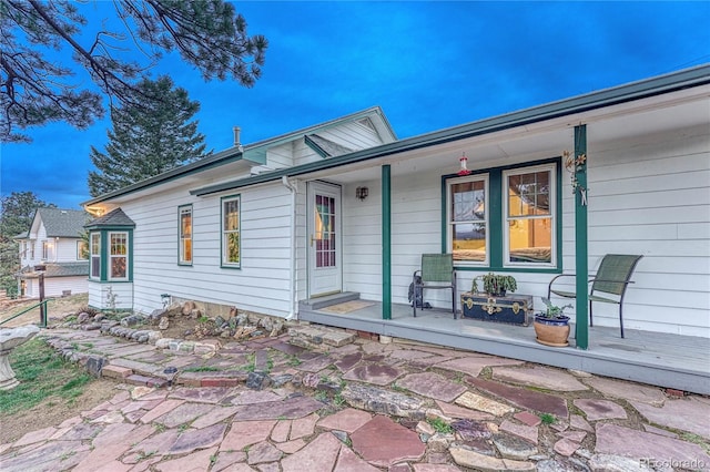 doorway to property with covered porch