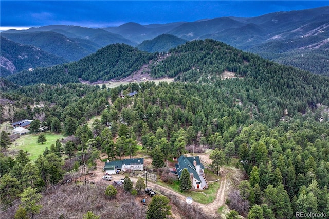 birds eye view of property featuring a mountain view