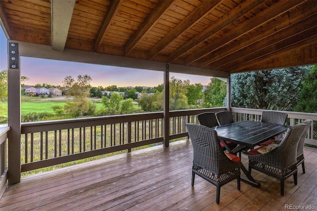 wooden terrace featuring outdoor dining area