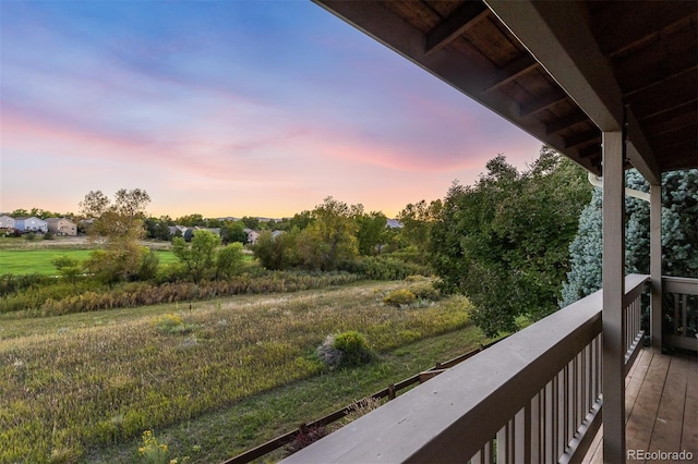 view of balcony at dusk