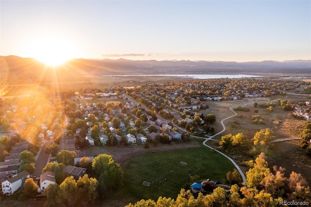 aerial view at dusk with a water and mountain view