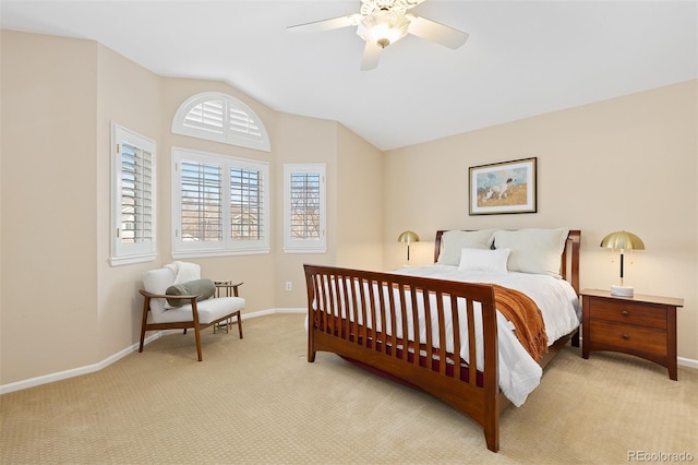 bedroom featuring light carpet, baseboards, a ceiling fan, and lofted ceiling