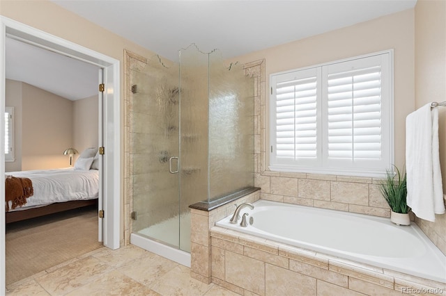 ensuite bathroom with a stall shower, a garden tub, and ensuite bath