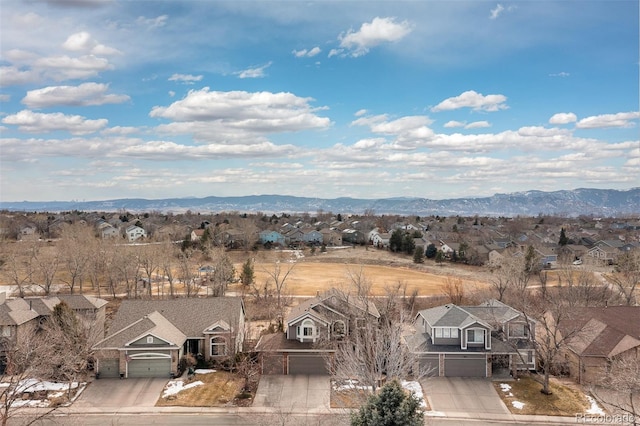 aerial view featuring a mountain view and a residential view