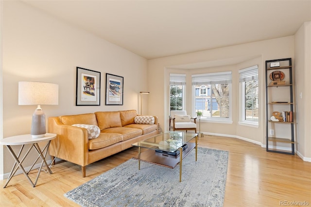 living room featuring light wood-style flooring and baseboards