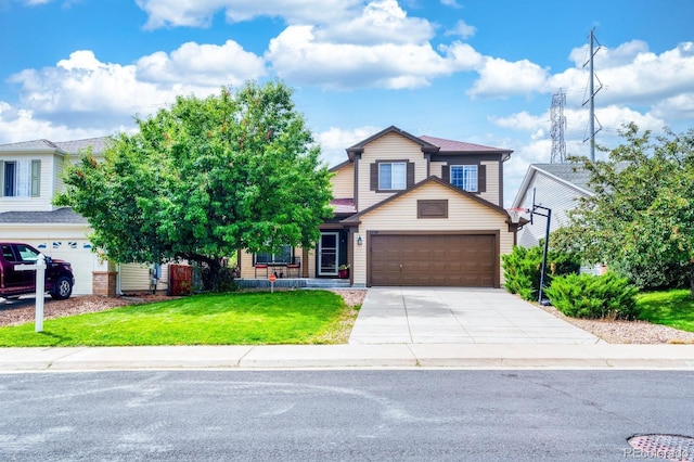 view of front of property featuring an attached garage, concrete driveway, and a front yard