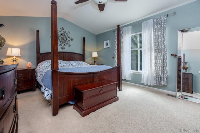 carpeted bedroom featuring vaulted ceiling, a ceiling fan, and baseboards