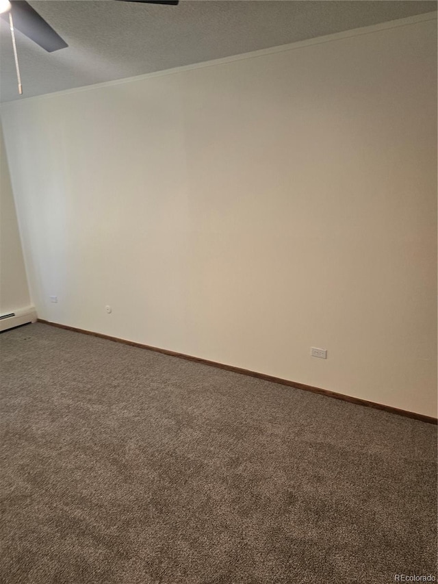 spare room with a textured ceiling, carpet floors, ceiling fan, and crown molding