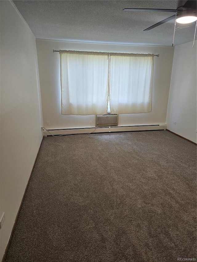 carpeted empty room with ceiling fan and a textured ceiling