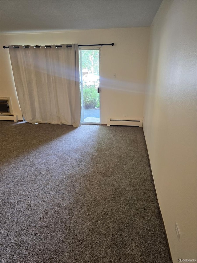 carpeted empty room with a baseboard radiator