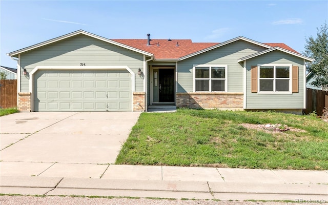 single story home with a garage, brick siding, fence, concrete driveway, and a front yard