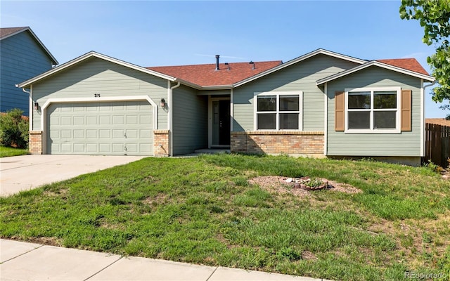 ranch-style home featuring brick siding, a shingled roof, concrete driveway, a front yard, and a garage