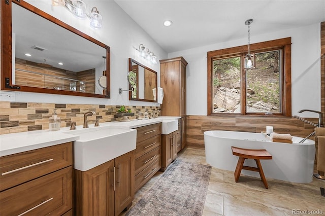 663 Brookside Dr, Bailey, CO 80421 - bathroom featuring vanity, a freestanding bath, recessed lighting, a shower, and a wainscoted wall