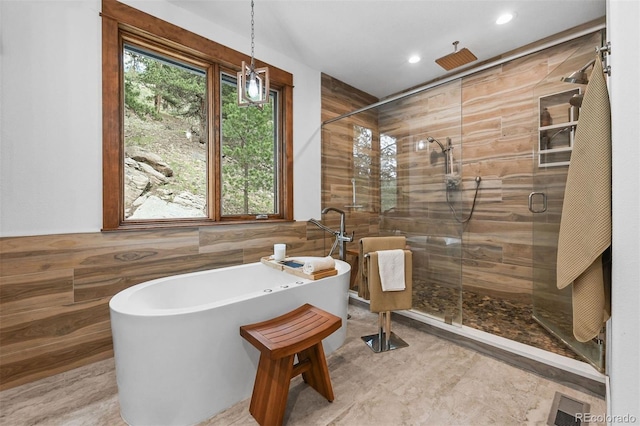 663 Brookside Dr, Bailey, CO 80421 - full bath featuring a shower stall, a freestanding bath, tile walls, and recessed lighting