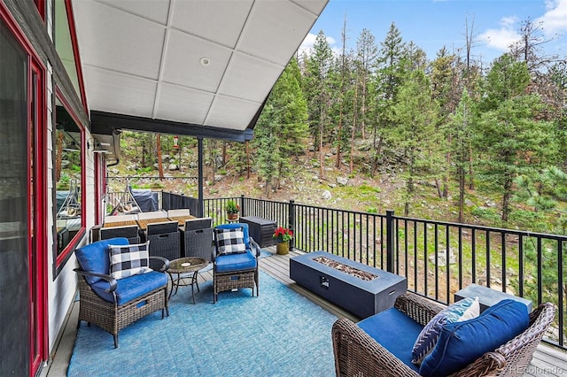663 Brookside Dr, Bailey, CO 80421 - wooden terrace featuring an outdoor living space with a fire pit