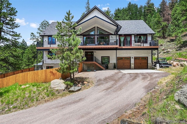 663 Brookside Dr, Bailey, CO 80421 - chalet / cabin featuring dirt driveway, a balcony, and a garage