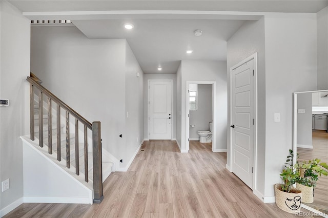 10912 Memphis Ct, Commerce City, CO 80022 - entryway featuring light wood-type flooring, baseboards, stairs, and recessed lighting