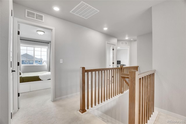 10912 Memphis Ct, Commerce City, CO 80022 - hall featuring an upstairs landing, baseboards, carpet floors, and recessed lighting