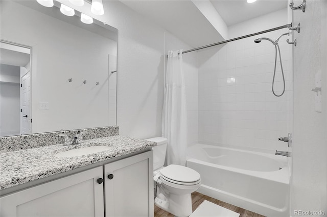 10912 Memphis Ct, Commerce City, CO 80022 - bathroom featuring wood finished floors, shower / tub combo with curtain, toilet, and vanity