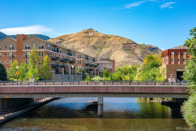 exterior space featuring a water and mountain view