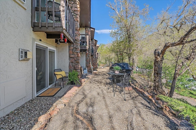 view of patio with a balcony