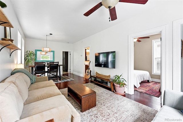 1331 Osceola St, Denver, CO 80204 - living area with ceiling fan, dark wood finished floors, and baseboards