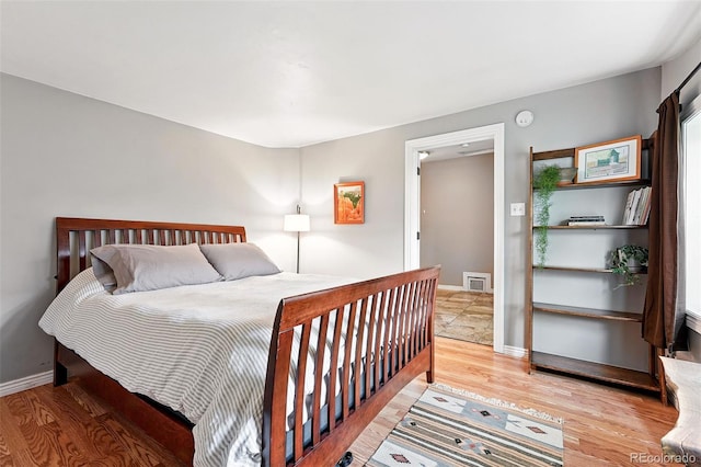 1331 Osceola St, Denver, CO 80204 - bedroom featuring wood finished floors and baseboards