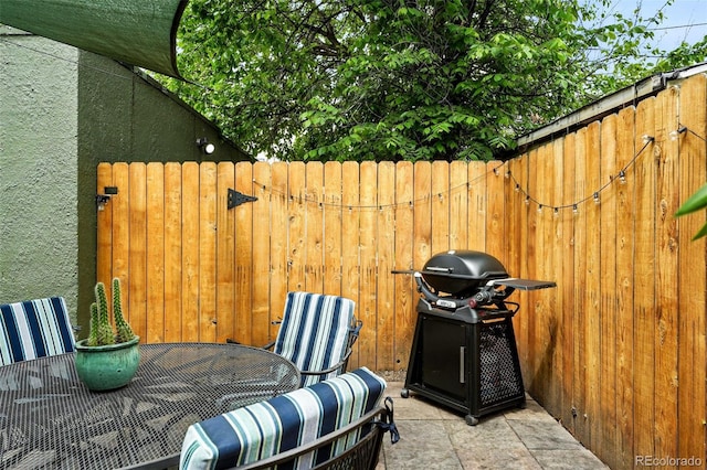 1331 Osceola St, Denver, CO 80204 - view of patio featuring a grill and outdoor dining area