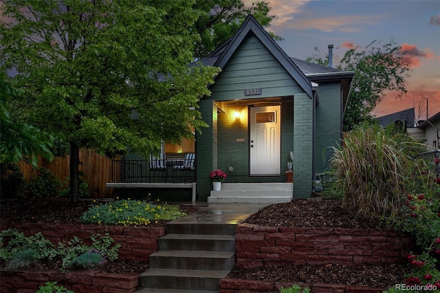 1331 Osceola St, Denver, CO 80204 - bungalow featuring covered porch and brick siding