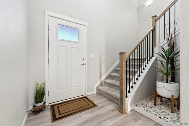 entryway with light hardwood / wood-style flooring