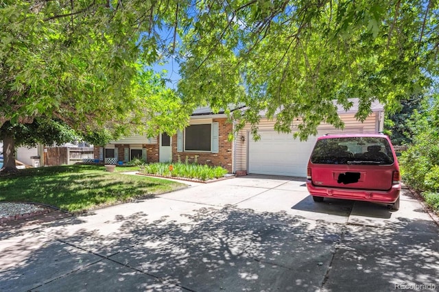2516 S Cimarron St, Aurora, CO 80014 - view of property hidden behind natural elements featuring concrete driveway, brick siding, roof mounted solar panels, a garage, and a front lawn