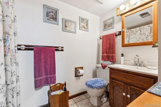 2516 S Cimarron St, Aurora, CO 80014 - bathroom with vanity, tile patterned floors, and a shower with shower curtain