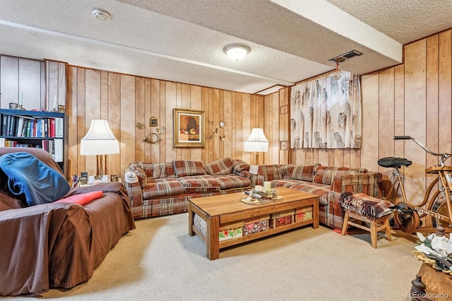 2516 S Cimarron St, Aurora, CO 80014 - living room featuring wooden walls, carpet floors, and a textured ceiling