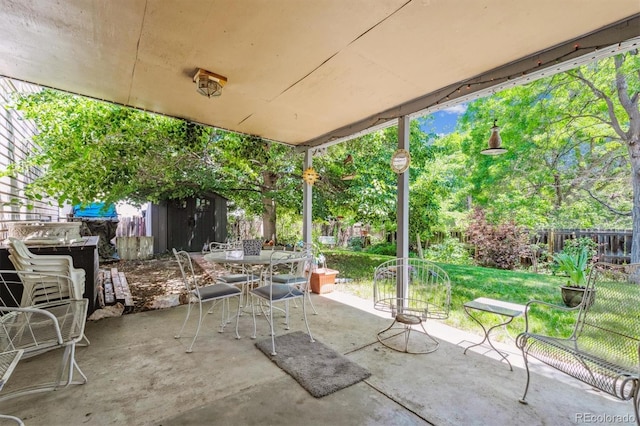 2516 S Cimarron St, Aurora, CO 80014 - view of patio with a storage shed and outdoor dining space