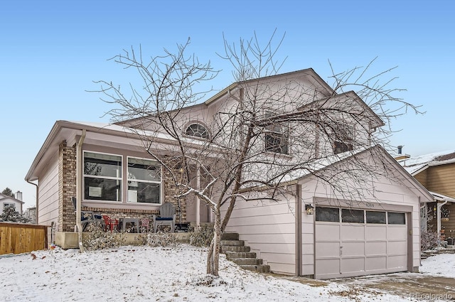 view of front of property with a garage