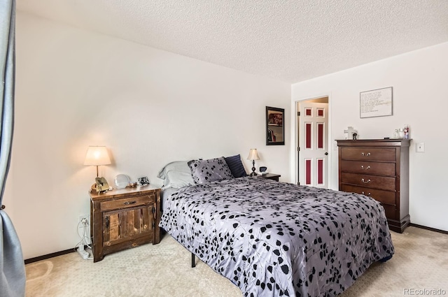 carpeted bedroom with a textured ceiling